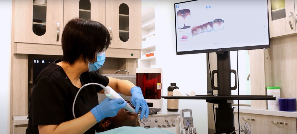 Dental technician using Aoralscan 3 in Dr. Hao's clinic